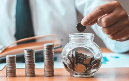 Person counting pennies at tax time