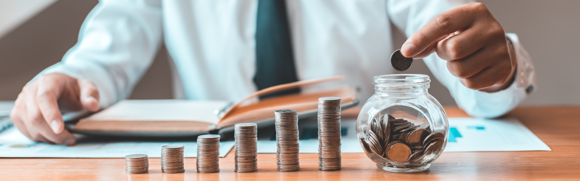 Person counting pennies at tax time