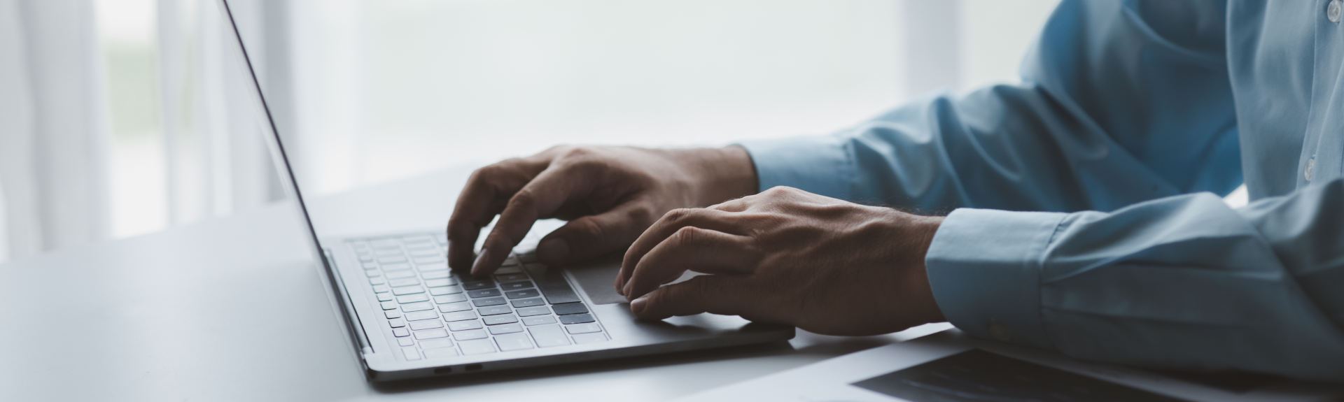 Hands on a laptop typing